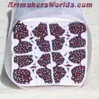 dotted maroon and white quilt cane