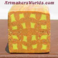 Yellow and orange check polymer clay cane